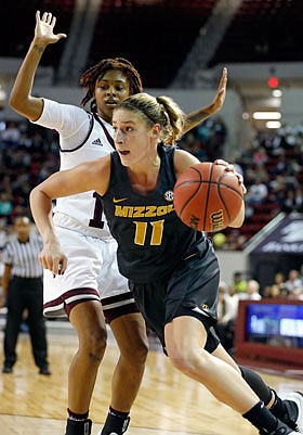 Missouri senior Lindsey Cunningham dribbles past Mississippi State guard Jazzmun Holmes during a game earlier this month in Starkville, Miss.