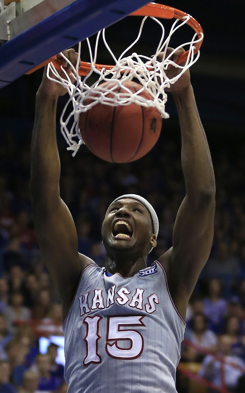 Kansas forward Carlton Bragg Jr. dunks during the first half of the team's NCAA college basketball game against TCU in Lawrence, Kan., Wednesday, Feb. 22, 2017. 