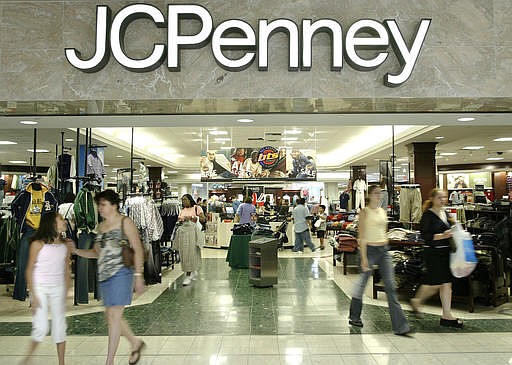 In this Aug. 16, 2005 file photo, customers walk out of a J.C. Penny department store in Dallas. 