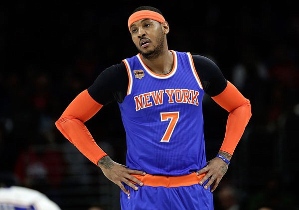 In this Jan. 11 file photo, Carmelo Anthony of the Knicks looks on during a break in a game against the 76ers in Philadelphia. Anthony stayed with the Knicks past Thursday afternoon's trade deadline.