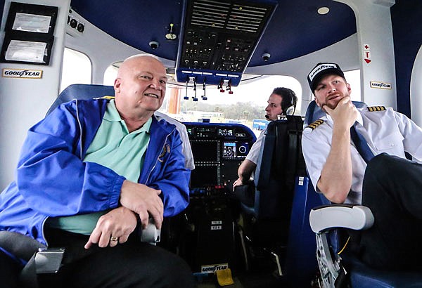 Dale Earnhardt Jr talks with military veteran Paul Siverson (left) before taking him for the experience of a lifetime Wednesday in the Goodyear blimp near Daytona Beach, Fla. (