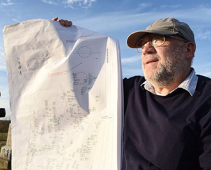 Michael Banak shows the mapping he's done so far in his research and work in Middle River Cemetery in Tebbetts. The map contains dozens of names and the location of their burial site within the graveyard.