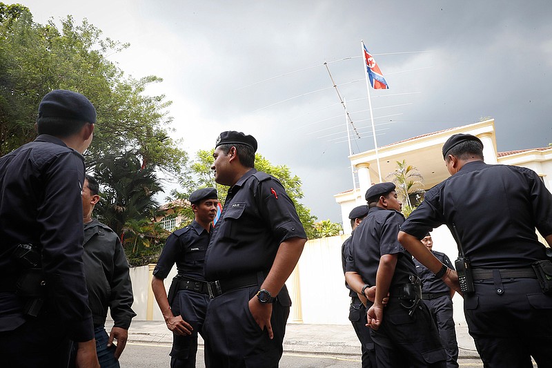 Malaysian Police stand outside North Korean Embassy in Kuala Lumpur, Malaysia, Thursday, Feb. 23, 2017. North Korea denied Thursday that its agents masterminded the assassination of the half brother of leader Kim Jong Un, saying a Malaysian investigation into the death of one of its nationals is full of "holes and contradictions." 