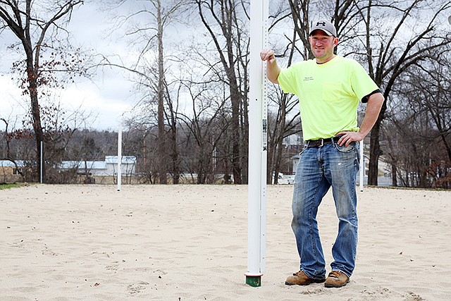 Senior Parks maintenance worker Bryan Braun, posing at Binder Lake State Park, was instrumental in constructing the new courts, which are receiving finishing details before opening for the season.