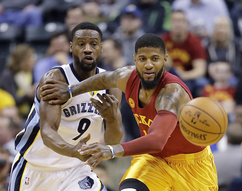 Indiana Pacers' Paul George and Memphis Grizzlies' Tony Allen go for a loose ball during the first half of an NBA basketball game Friday, Feb. 24, 2017, in Indianapolis. 