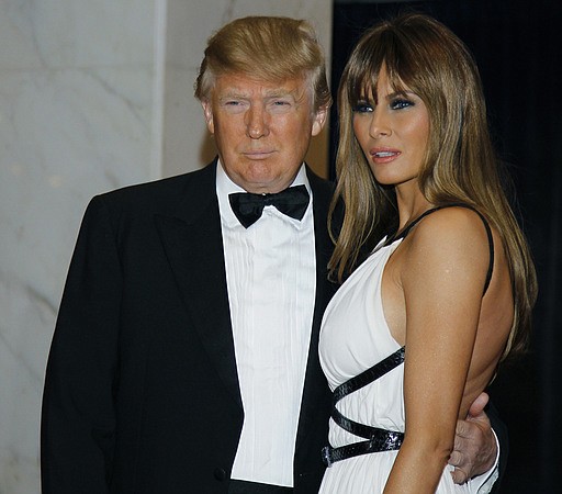 In this April 30, 2011, file photo Donald Trump, left, and Melania Trump arrive for the White House Correspondents Dinner in Washington. President Donald Trump says he won't be attending the annual White House Correspondents' Association dinner this spring.