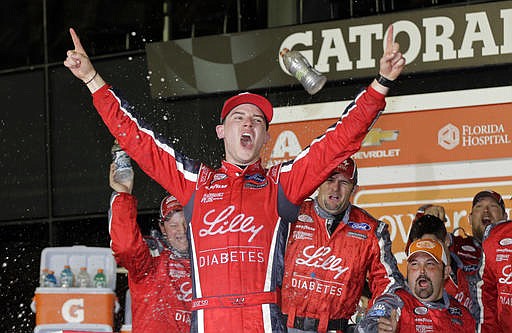 Ryan Reed celebrates in Victory Lane after winning the NASCAR Xfinity series auto race at Daytona International Speedway in Daytona Beach, Fla., Saturday, Feb. 25, 2017. 