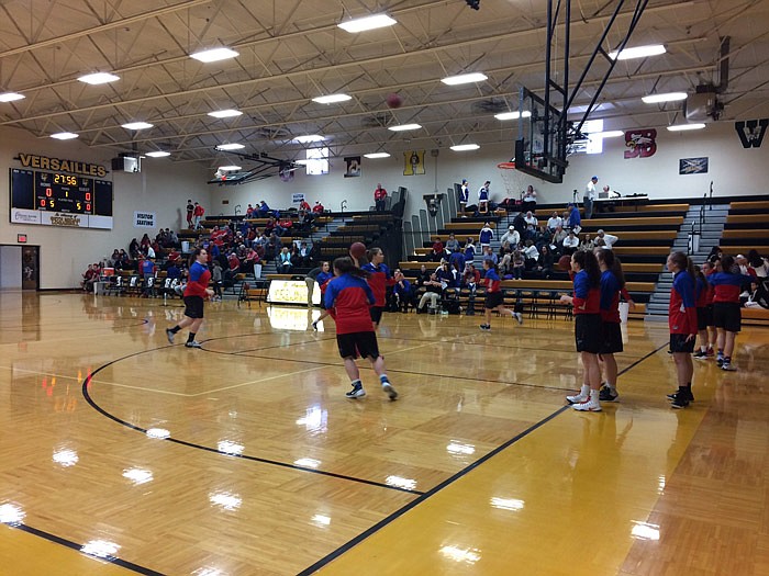 Teams warm up in advance of the Class 3 District 13 Tournament girls championship between Boonville and California on Saturday, Feb. 25, 2017 in Versailles.
