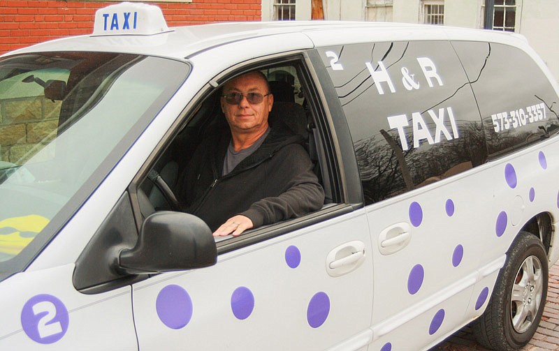 Rickey Lacey and his polka-dot taxi. As of Tuesday, Lacey's H&R Taxi provides Fulton a 24-hour taxi service to anywhere in Missouri.