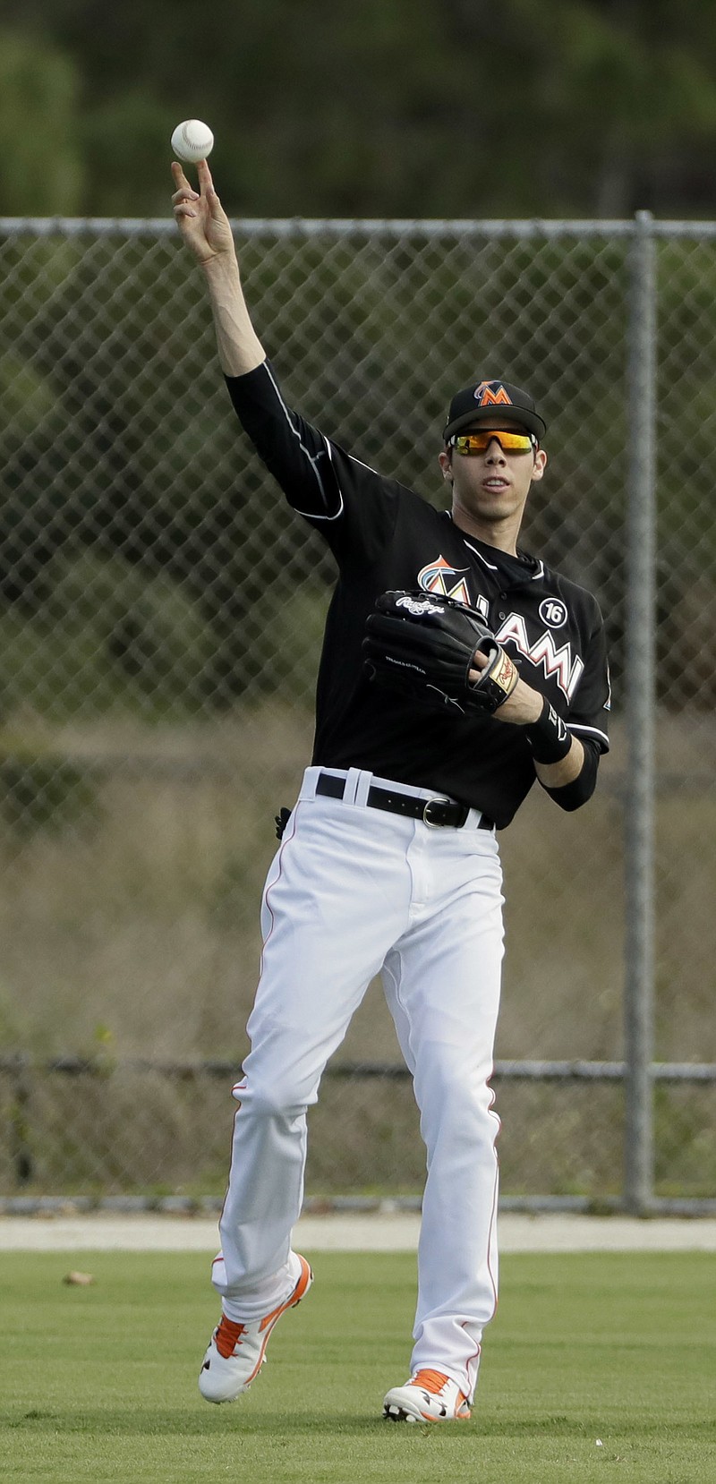 Miami Marlins left fielder Christian Yelich throws during a spring training baseball workout Saturday, Feb. 18, 2017, in Jupiter, Fla. Marlins manager Don Mattingly expects the left-handed hitting Yelich, a former Gold Glove winner, current member of Team USA for the World Baseball Classic and a career .293 hitter, to take another step forward this season.