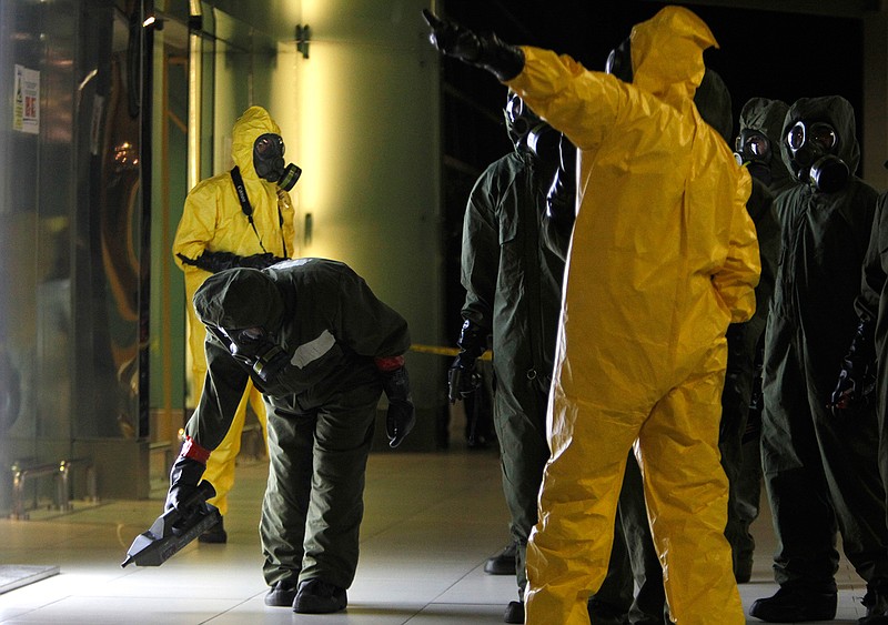 A hazmat crew scan the decontamination zone at Kuala Lumpur International Airport 2 in Sepang, Malaysia on Sunday, Feb. 26, 2017. Malaysian police ordered a sweep of Kuala Lumpur airport for toxic chemicals and other hazardous substances following the killing of Kim Jong Nam.