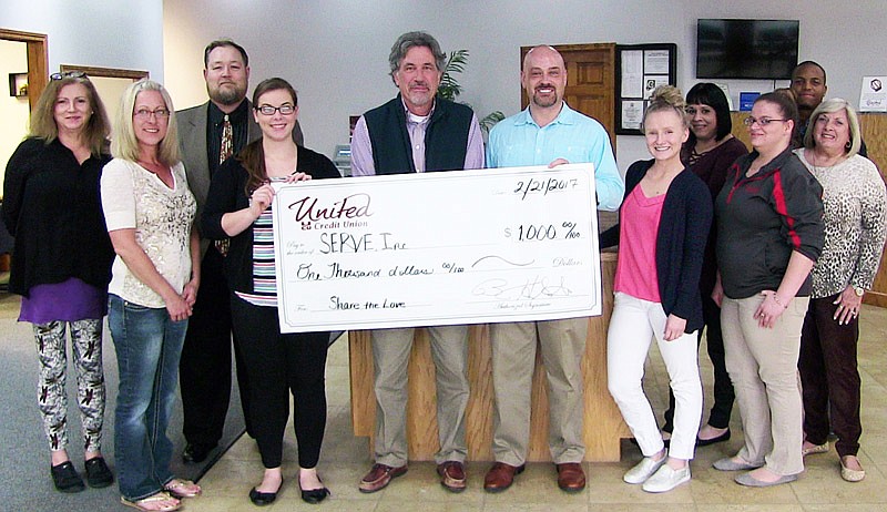 Employees of the Fulton branch of United Credit Union donated $1,000 to SERVE Inc.