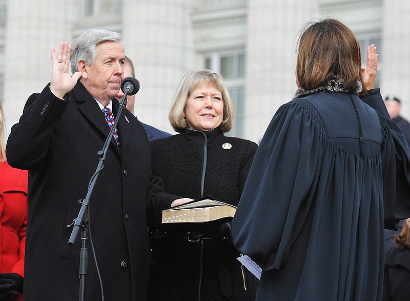 With his wife Teresa Parson at his side, Mike Parson is sworn in as Missouri's lieutenant governor during inauguration day ceremonies in January 2017.