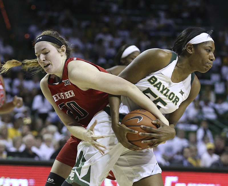 Baylor center Khadijiah Cave, right, pulls down a rebound over Texas Tech forward Brittany Brewer, left, in the first half of an NCAA college basketball game, Saturday, Feb. 25, 2017, in Waco, Texas. 