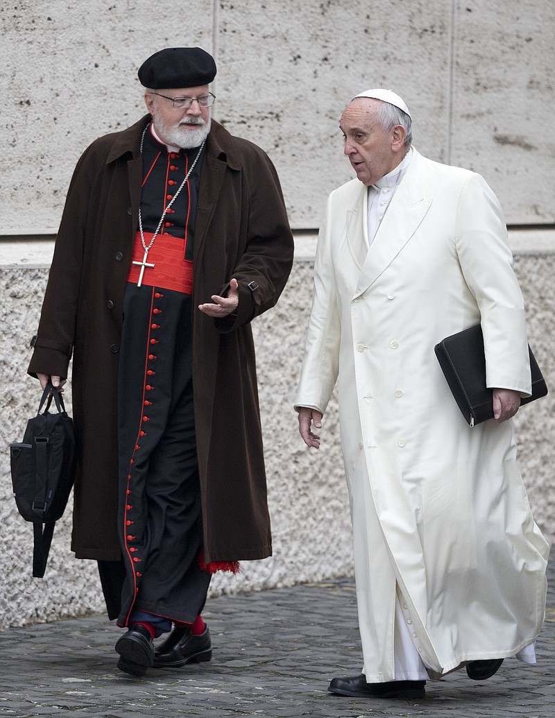 In this Feb. 13, 2015 file photo, Pope Francis, right, talks with the head of a sex abuse advisory commission, Cardinal Sean Patrick O'Malley, of Boston, as they arrive for a special consistory in the Synod hall at the Vatican. Pope Francis has quietly reduced sanctions against a few pedophile priests, applying his vision of a merciful church even to its worst offenders in ways that abuse survivors and the pope's own advisers question. 