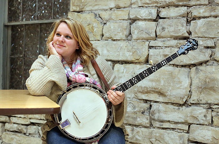 Janice Martin poses for a portrait at Avenue HQ in Jefferson City. Martin is the founder of the Blue Grass Martins band and has been playing the banjo for 16 years.