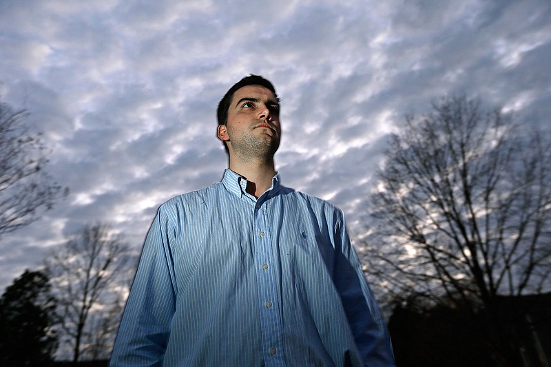 This Thursday, Feb. 2, 2017 photo shows John Cooper near his home in Chapel Hill, N.C. Cooper recounted what happened to him at a meeting of nearly three dozen young ministers on April 12, 2012, when he was 19. One by one, the ministers were sharing stories of how they were serving God. When it was Cooper's turn, a church elder interrupted and accused him of "giving in to the unclean" _ a catchall phrase covering a wide array of sins. Suddenly, Cooper said, he was pinned to the floor and pummeled for a half-hour, accused of having erotic fantasies. When the assault ended, Cooper said his body was covered with bruises and he had trouble breathing for weeks.