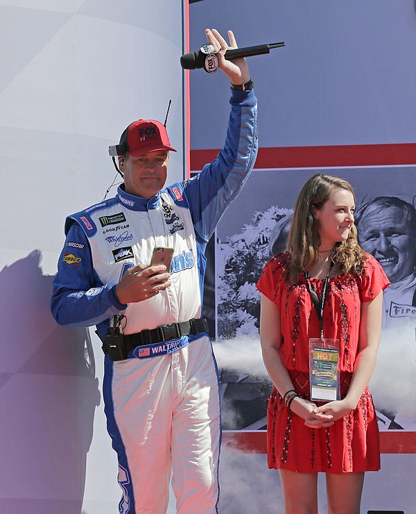 Michael Waltrip is introduced with his daughter Margaret Waltrip before the Daytona 500 on Sunday at Daytona International Speedway in Daytona Beach, Fla.