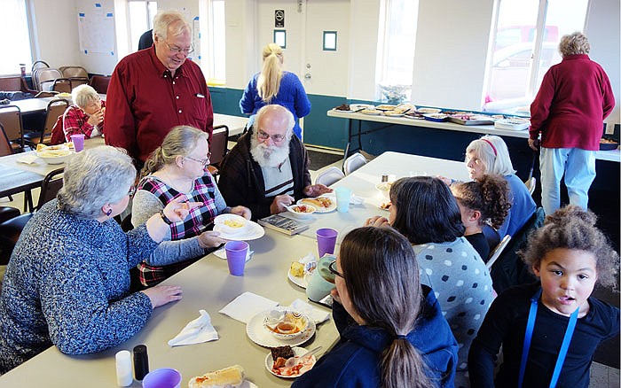 Neighbors and pals in Tebbetts enjoy a weekend chili cook-off, which raised funds for the Middle River Cemetery Association.