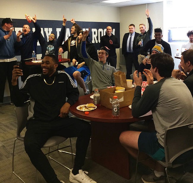 Players from the Westminster College men's basketball team react to hearing where it will play its first-round game of the NCAA Division III Tournament on Monday in the Rally Room at Westminster. The Blue Jays will face the nationally-ranked Hanover College Panthers in the opening round of the tournament at 6:30 p.m. Friday in Hanover, Ind. The Panthers are ranked No. 16 in the nation.