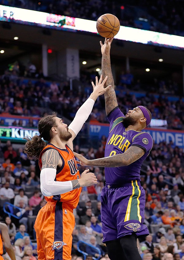 Pelicans forward DeMarcus Cousins shoots past Thunder center Steven Adams during the first half of Sunday's game in Oklahoma City.