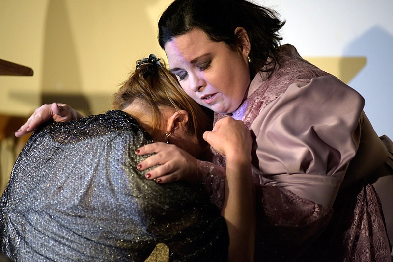 Rachel Winslow, played by DeAnn Martin, comforts Loreen, played by Karin Spradlin
during a rehearsal Monday, Feb. 27, 2017 of "In His Steps" at the Stained Glass Theatre. "In His Steps" is a play about a religious group that takes a pledge to live their lives in a Christ-like manner for a whole year.