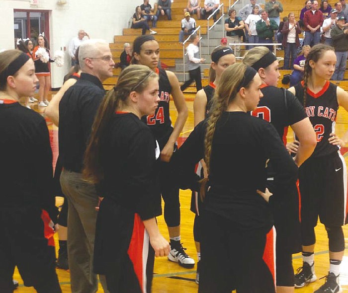 New Bloomfield head coach Brett Craighead and his Lady Wildcats look on during player introductions before the Class 2 sectional game Wednesday, March 1, 2017 against Westran at Mexico High School. New Bloomfield prevailed 54-51.