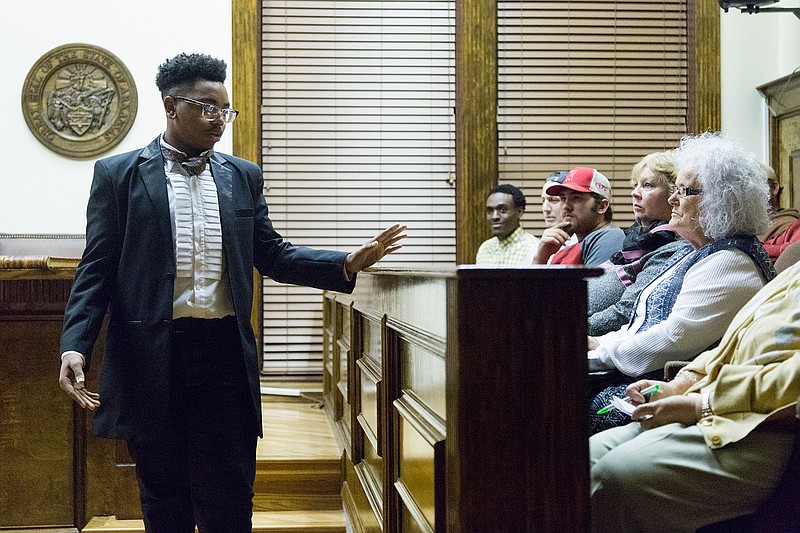 RaQuan French, playing a defense attorney, addresses the jury Thursday during a mock trial at the Little River County Courthouse in Ashdown, Ark. Ashdown High School Theater performed the trial as part of the city's sesquicentennial celebrations. The mock trial is based off a real case that took place in Hempstead County in 1844, with a jury chosen at random from the audience. The final performance is Friday at 7 p.m.