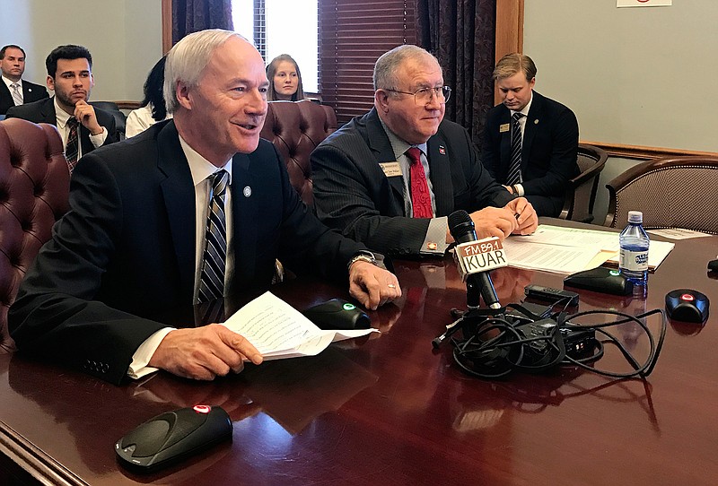 Arkansas Gov. Asa Hutchinson, left, and Sen. Dave Wallace speak to the Senate Education Committee Thursday, March 2, 2017, in Little Rock about a proposal to remove Confederate Gen. Robert E. Lee from the state holiday honoring slain civil rights leader Martin Luther King Jr. The committee endorsed the proposal and sent it to the full Senate. Arkansas is one of three states to commemorate the men on the same day, and Hutchinson says ending the dual holiday would help unify Arkansas. 