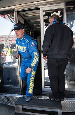 Derrike Cope heads to the garage to work on his car after a practice session Friday at Atlanta Motor Speedway in Hampton, Ga.