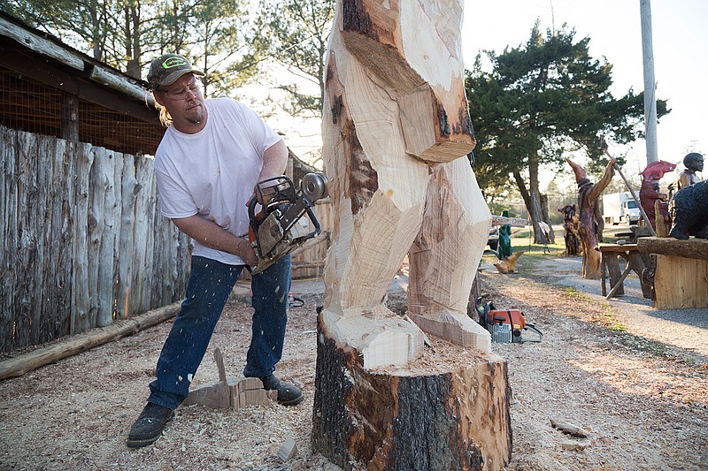 Nick Bero sculpts a Sasquatch out of oak at his studio in De Queen, Ark.