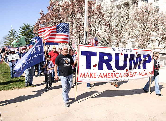 Hundreds of Trump supporters peacefully march around the Capitol Saturday, March 4, 2017 in solidarity and celebration of the president as part of the national March 4 Trump movement.