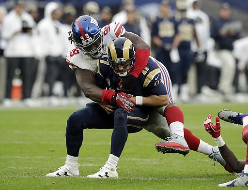  In this Oct. 23, 2016, file photo, New York Giants defensive tackle Damon Harrison (98) tackles Los Angeles Rams quarterback Case Keenum (17) during an NFL football game at Twickenham stadium in London. Defensive tackle Damon "Snacks" Harrison played right under the noses of the New York Giants, spending his first four seasons in the same stadium playing for the Jets after going undrafted out of the NAIA-level William Penn. 