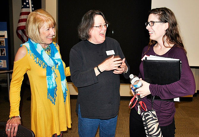 Jan Reyes (left) and Joan Berry Morris, members of the Rotary Club of Fulton, speak with prospective member Leah Rogers, a teacher at Hermann High School. 