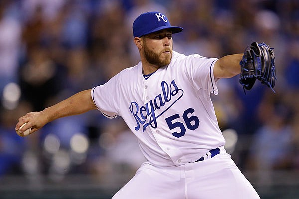 In this April 8, 2015, file photo, Greg Holland throws a pitch for the Royals at Kauffman Stadium.