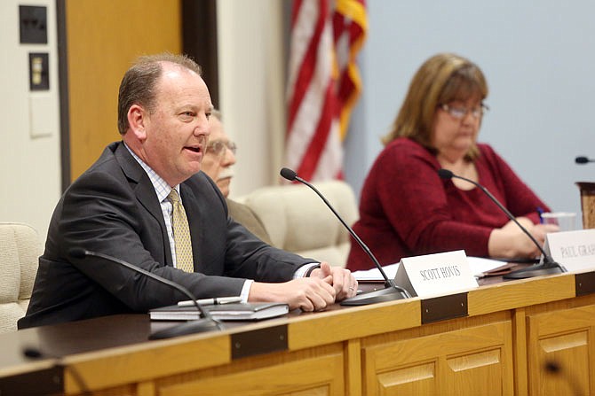 Jefferson City School Board candidate Scott Hovis, left, speaks during a Tuesday forum at City Hall. Two forums discussed the JCPS school board races and the bond and levy issues facing voters in the district.