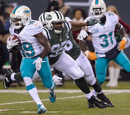 Jets linebacker Josh Martin looks to make a tackle during a game against the Dolphins last season in East Rutherford, N.J.