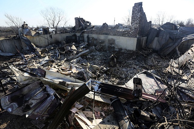 A pile of rubble is all that remains of the home of Jeff and Zane Jackson on Wednesday in the Highlands subdivision in Hutchinson, Kansas. The home was destroyed in the wildfires Monday night.