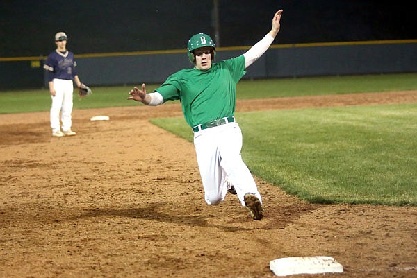 Tyler Gish of Blair Oaks slides into third base during a scrimmage against Helias at Friday night's Jamboree at Vivion Field.