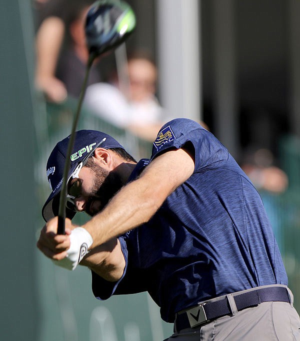 Adam Hadwin drives at No. 18 while playing in the second round of the Valspar Golf Championship on Friday at Innisbrook Resort and Golf Club's Copperhead Course in Palm Harbor, Fla. 