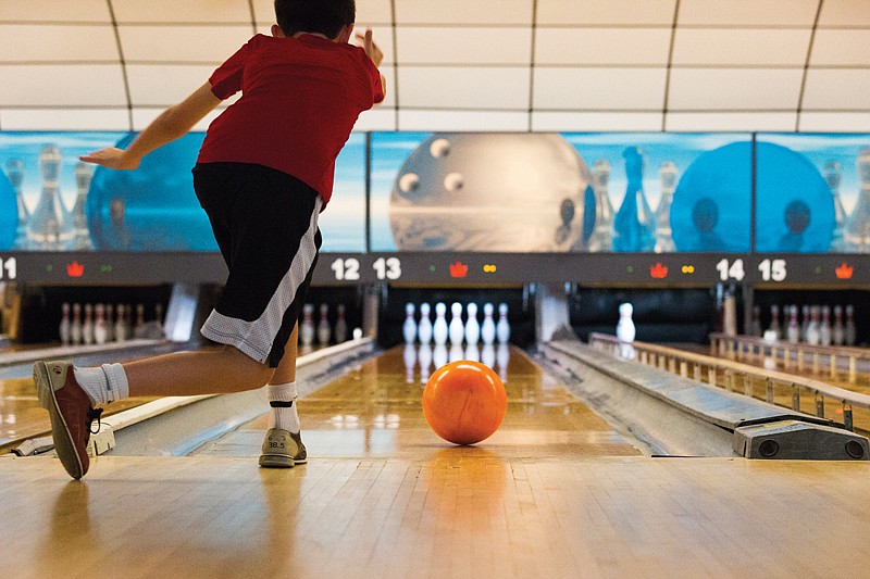 Adam Thomas, 12, bowls with his family Monday at Holiday Bowl. Thomas is on spring break, and whenever he and his family come to Texarkana, they bowl with their cousins. 