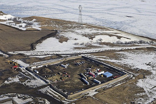 In this Feb. 13, 2017, aerial file photo shows the site where the final phase of the Dakota Access Pipeline will take place with boring equipment routing the pipeline underground and across Lake Oahe to connect with the existing pipeline in Emmons County near Cannon Ball, N.D. 