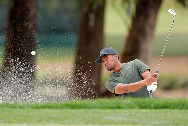 Tony Finau chips onto the first green during Sunday's final round of the Valspar Championship in Palm Harbor, Fla.