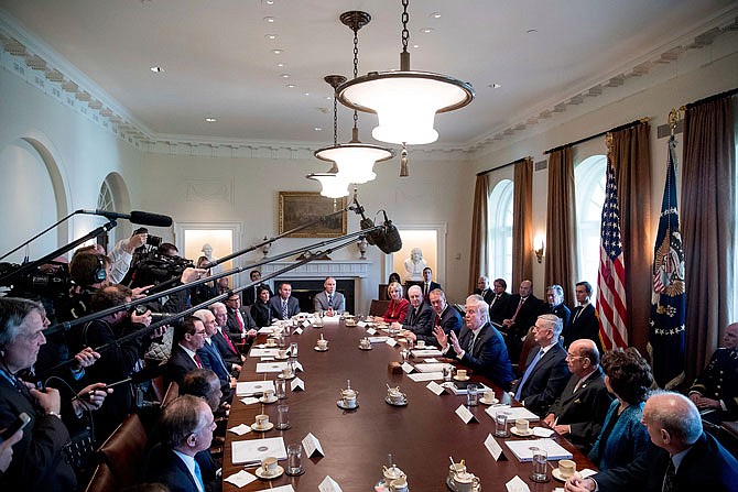 President Donald Trump speaks during a meeting with his Cabinet Monday in the Cabinet Room of the White House in Washington. 