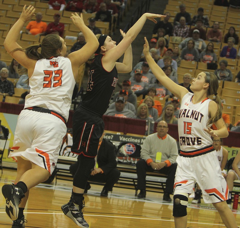 Prairie Home's Kristen Peterson has a shot contested in Thursday's 57-36 loss to Walnut Grove.