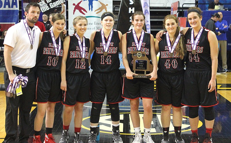 Prairie Home stands with their medals and plaque after taking fourth place in the Class 1 girls Show-Me Showdown. Pictured (left to right): head coach Dalton Armontrout, Ashlyn Twenter, Elizabeth Fairchild, Kristen Peterson, Rachel Distler, Kurstin Leonard and Shianne Rhorer.