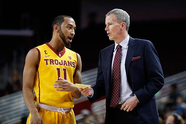 Southern California head coach Andy Enfield talks to Jordan McLaughlin during a game earlier this month against Washington State in Los Angeles. Southern California will face Providence tonight in the NCAA Tournament.