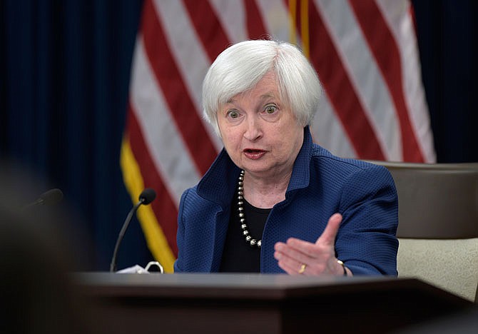 Federal Reserve Chair Janet Yellen speaks during a Wednesday news conference in Washington. The Federal Reserve is raising its benchmark interest rate for the second time in three months and signaling any further hikes this year will be gradual.