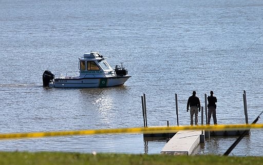 Conservation police search Silver Lake in Highland, Ill., on Thursday, March 16, 2017, after a car with an infant was pulled from the lake earlier in the morning. (Laurie Skrivan/St. Louis Post-Dispatch via AP)