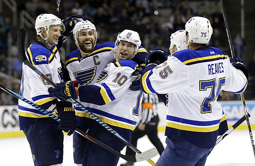St. Louis Blues' Scottie Upshall (10) celebrates his goal with teammates Ryan Reaves (75) Alex Pietrangelo, second from left,, and Jay Bouwmeester during the first period of an NHL hockey game against the San Jose Sharks Thursday, March 16, 2017, in San Jose, Calif.